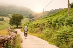 Lonely Pilgrim with backpack walking the Camino de Santiago in Spain, Way of St James