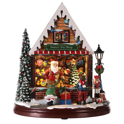 Décor magasin de jouets de Père Noël 25x25x15 cm